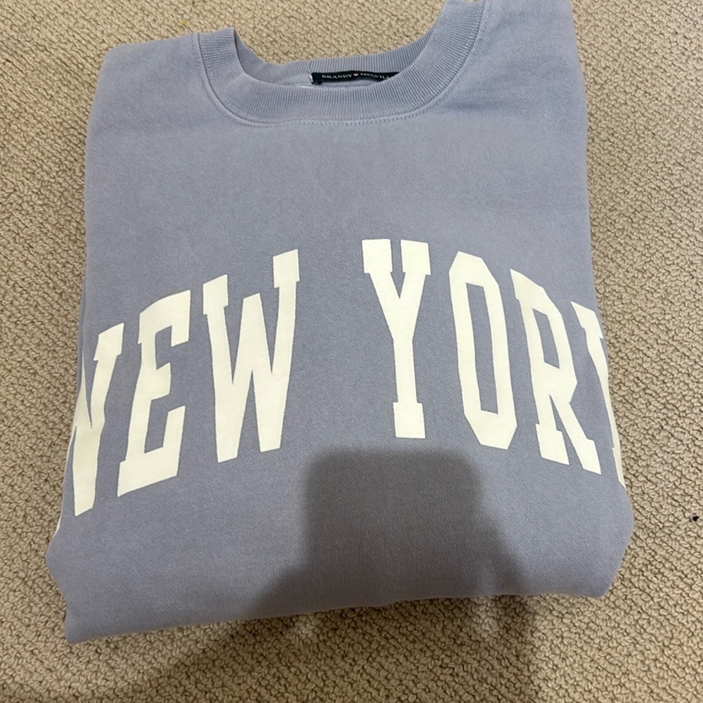 Quite a bit stained on the back but still super cute